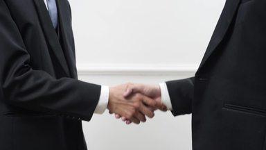hands of a businessman shaking hands