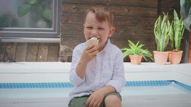 boy sitting and eating ice cream