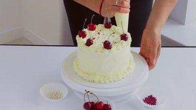 a person who decorates a whole cake