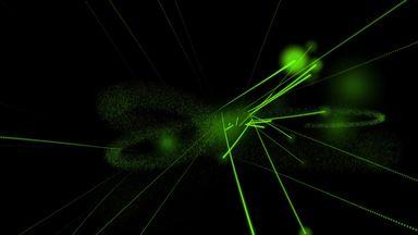 発光した粒子がランダムに飛び回る　緑色