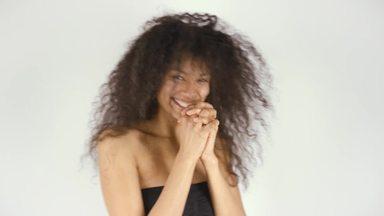 Woman with curly hair shaking her head