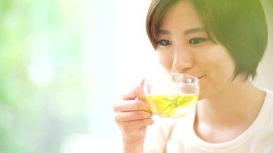young woman enjoying herbal tea