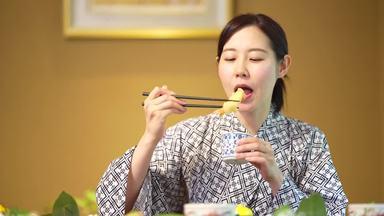 a woman eating at an inn