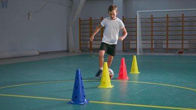 boy practicing s-shape in soccer