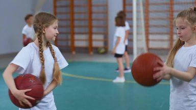 girl practicing basketball