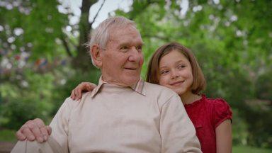 girl talking to grandpa