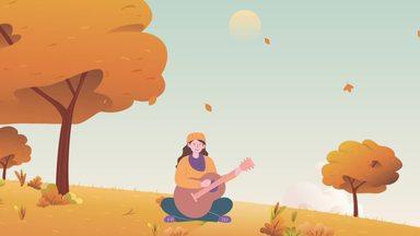 woman playing the guitar in the fall
