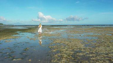 woman standing in shallow water
